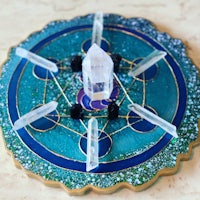 a blue plate with crystals and stones on it